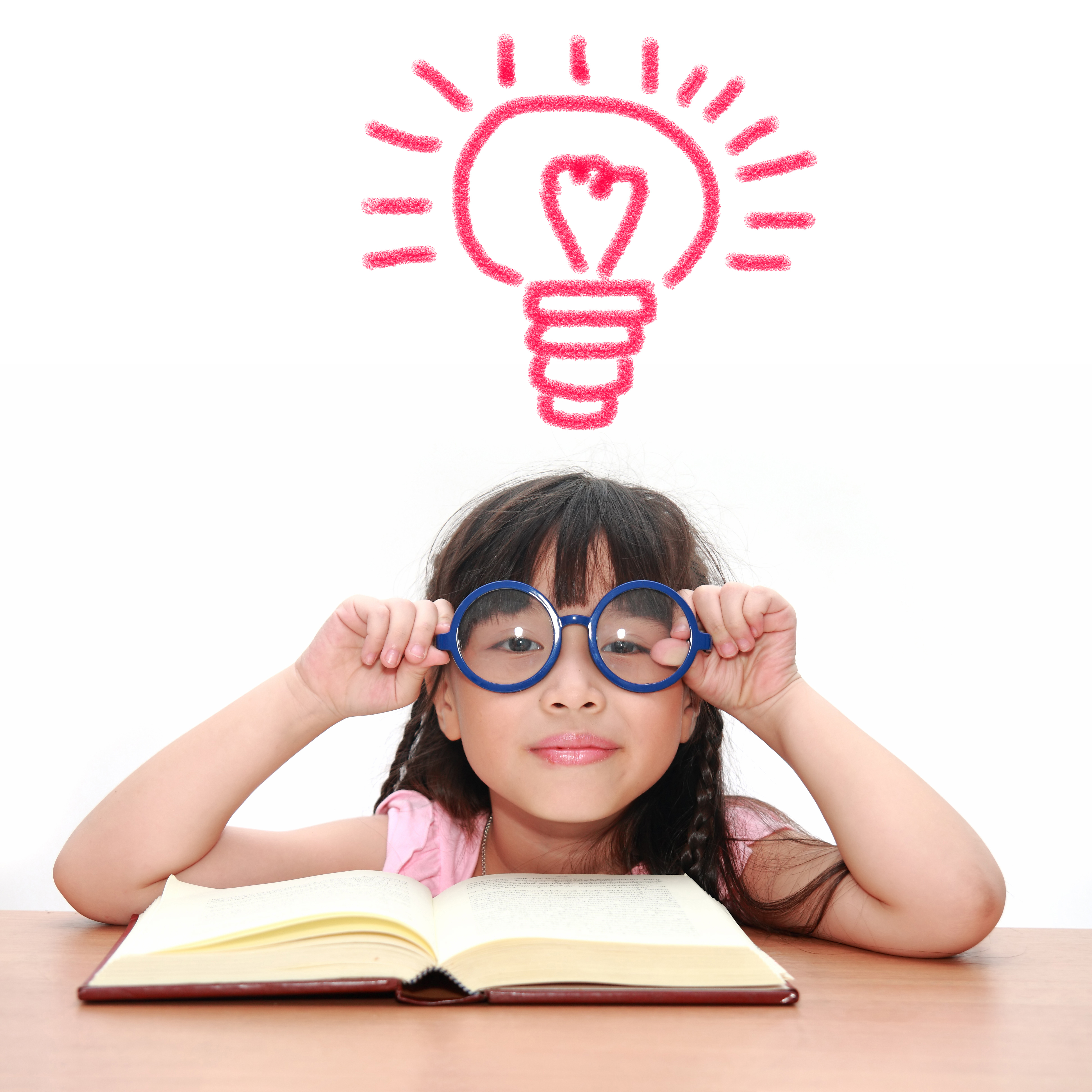 A girl wearing glasses, reading a book with a drawn lighbulb over her head